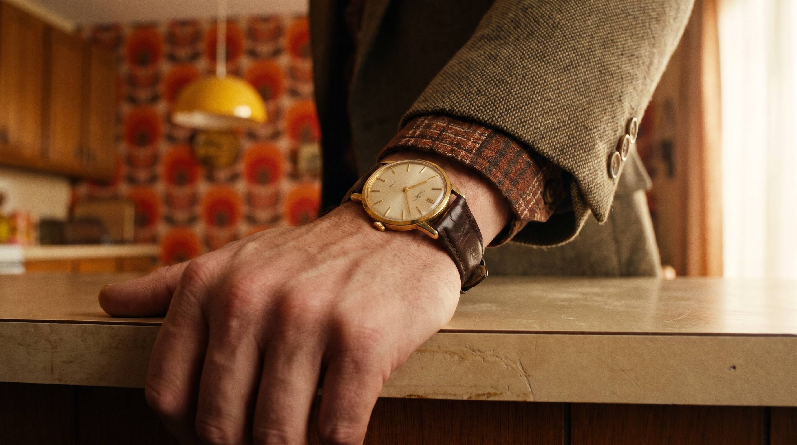 The same gold watch on a man’s hand, thirty years earlier.